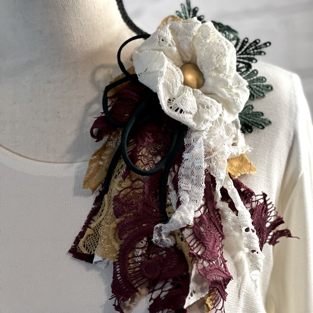 One of a kind hand made  lapel pin. Ivory with burgundy and mustard accents
